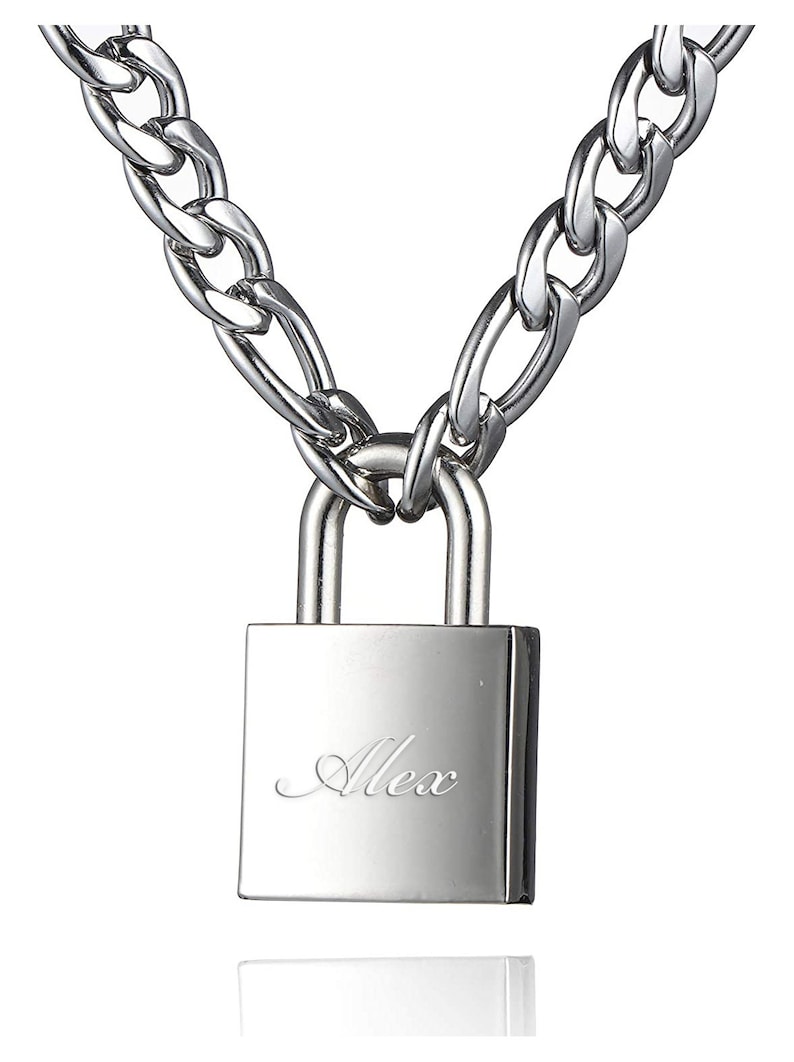 May include: Silver chain necklace with a padlock pendant engraved with the name "Alex".