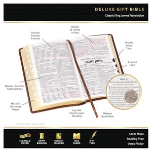 May include: A brown vegan leather Deluxe Gift Bible with a lay-flat Smyth-sewn binding. The Bible features a double column format, reader-friendly subheadings, metallic gilt-edge pages, words of Christ in red, thumb index tabs, a ribbon bookmark, and 9-point type. The Bible has 1002 pages.