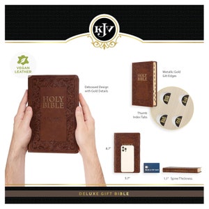 May include: A brown vegan leather Holy Bible with gold accents and embossed details. The Bible has thumb index tabs and measures 8.7 inches tall and 5.7 inches wide. The spine is 1.1 inches thick.