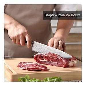 May include: A chef's knife with a patterned blade is slicing through a piece of raw red meat on a wooden cutting board. The knife has a black handle. The text "Ships Within 24 Hours!" is visible in the image.
