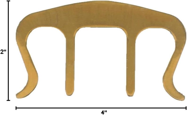 May include: A gold-colored metal wire cable clip with three prongs, measuring 4 inches wide and 2 inches tall.