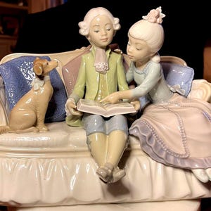 Lladro “Story Time” glazed fine porcelain collectible figurine made in Spain in 1984 and retired in 1989.  Artist signed and numbered