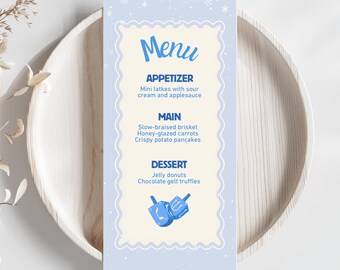 May include: A light blue menu card with a decorative border and the word "Menu" in blue script. The menu lists appetizer, main course, and dessert options, including mini latkes, slow-braised brisket, and jelly donuts. The menu is on a wooden plate.
