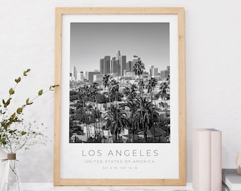 May include: Black and white photograph of the Los Angeles skyline with palm trees in the foreground. The text "Los Angeles, United States of America, 34° 3' N, 118° 15' W" is printed below the image.