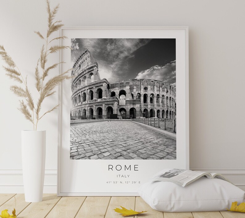 May include: Black and white photograph of the Colosseum in Rome, Italy. The text "ROME ITALY 41&deg; 53' 53" N, 12&deg; 29' 29" E" is printed below the image.