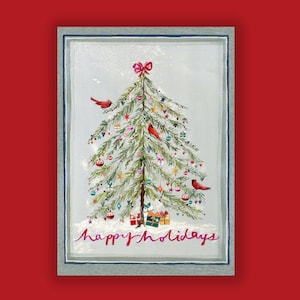 May include: A Christmas card featuring a watercolor illustration of a decorated evergreen tree with red cardinals, ornaments, and presents. The text "Happy Holidays" is written in cursive at the bottom of the card.