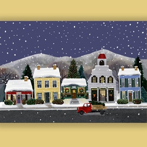 May include: A winter scene illustration depicts a snow-covered town with colorful buildings, including a red house, yellow house, and blue house. A red truck carries a Christmas tree. Snow falls against a dark blue sky and a mountain backdrop.