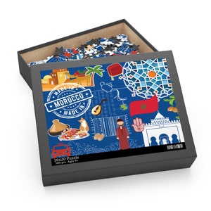 May include: A 500-piece jigsaw puzzle featuring a colorful illustration of Moroccan culture. The puzzle depicts a camel, a traditional Moroccan rug, a hand with the Hamsa symbol, a taxi, and a stamp that says "Made in Morocco".