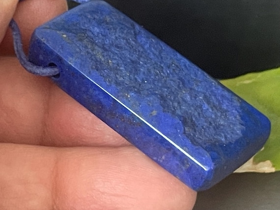 Beautiful drilled lapis lazuli pendant – a unique piece of spiritual gemstone jewelry for intuition, truth, new energy. The magic eye.