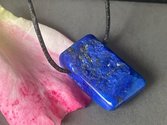 Genuine lapis lazuli pendant drilled in a unique design