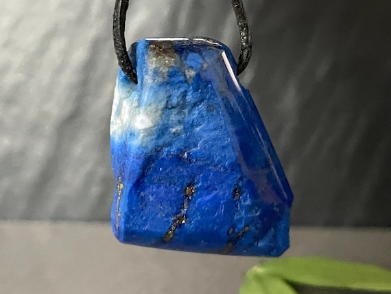 Genuine lapis lazuli pendant drilled in a unique design