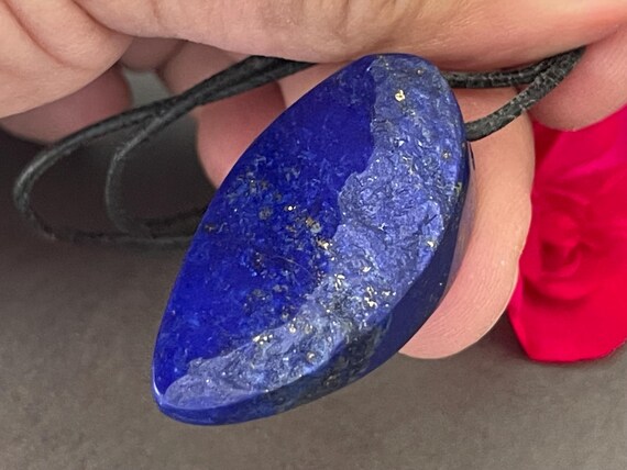 Genuine lapis lazuli pendant drilled in a unique design