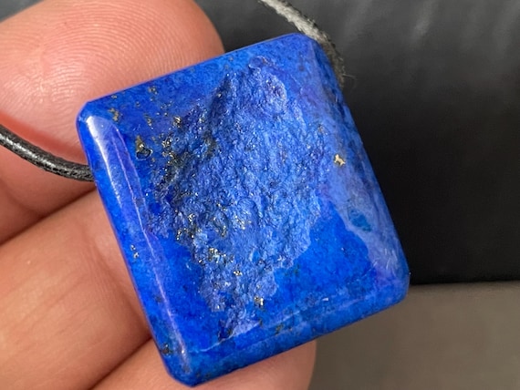 Genuine lapis lazuli pendant drilled in a unique design