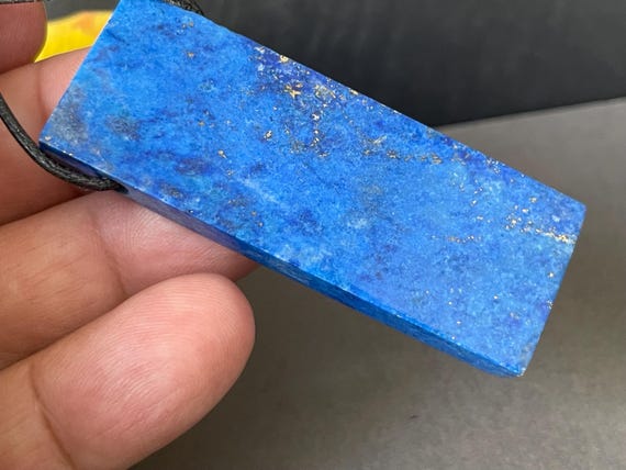 Genuine lapis lazuli pendant drilled in a unique design, super wide and fine!