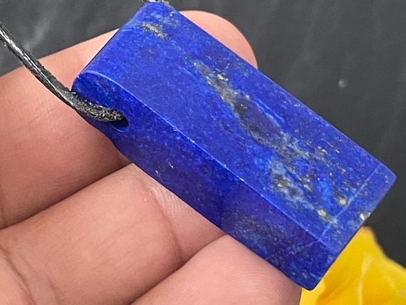Genuine lapis lazuli pendant drilled in a unique design