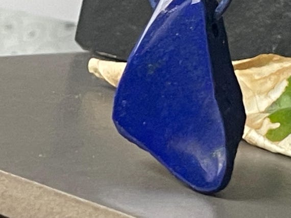 Beautiful drilled lapis lazuli pendant – a unique piece of spiritual gemstone jewelry for intuition, truth, new energy. The magic eye.