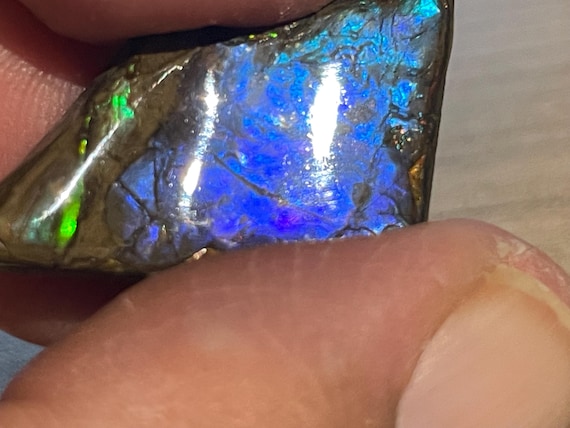 Very rare ammolite pendant from Canada – a unique fossil gemstone with a spectacular play of colors, a rather rare blue metallic hue.