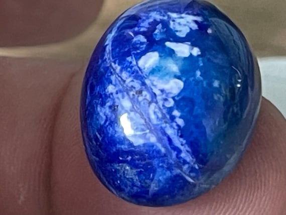 A stone that enchants immediately: Lapis lazuli – cabochon handcrafted – deep blue tones harmonizing with beautiful calcite, beautiful