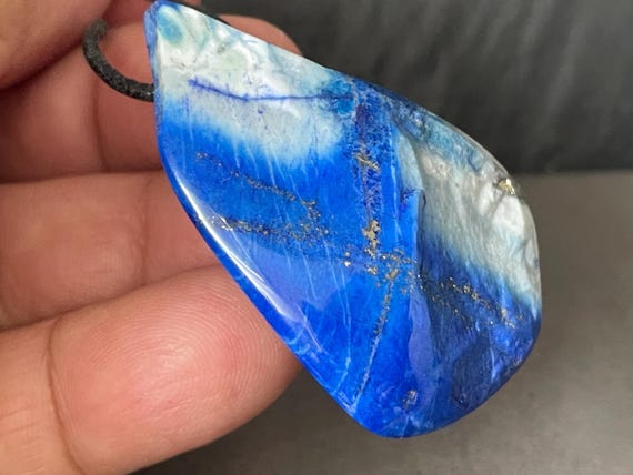 Genuine lapis lazuli pendant drilled in a unique design