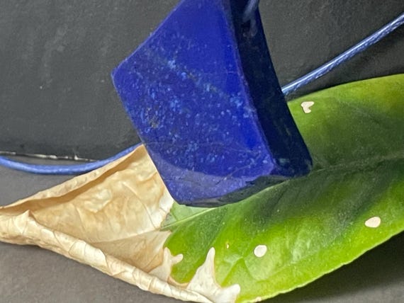 Beautiful drilled lapis lazuli pendant – a unique piece of spiritual gemstone jewelry for intuition, truth, new energy. The magic eye.