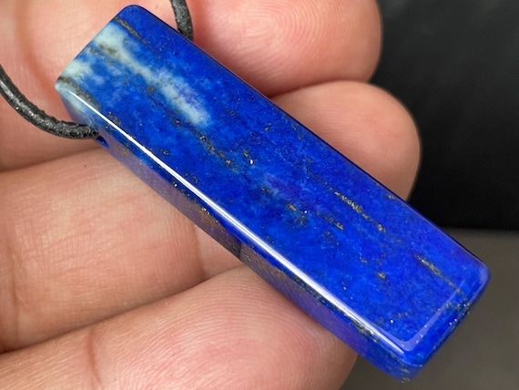 Genuine lapis lazuli pendant drilled in a unique design