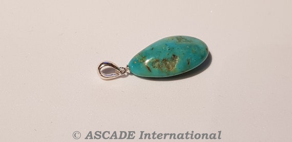 Small, sweet turquoise pendant with a silver eyelet