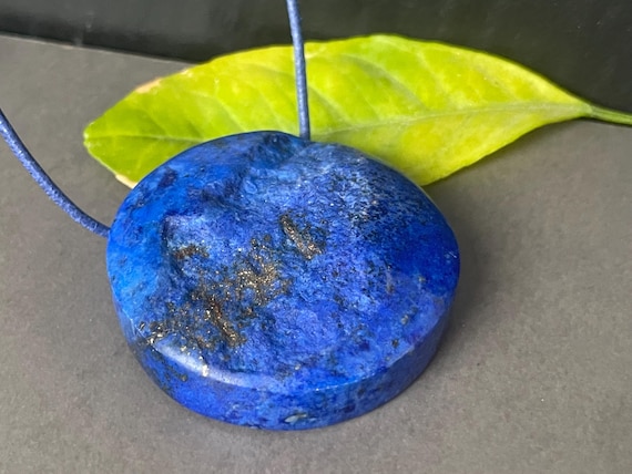 A rather large, beautiful, drilled lapis lazuli pendant – a unique piece of spiritual gemstone jewelry for intuition, truth, and new energy.