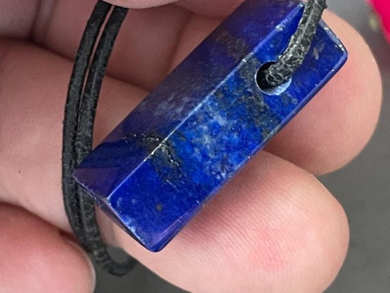 Genuine lapis lazuli pendant drilled in a unique design
