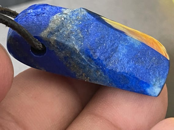 Genuine lapis lazuli pendant drilled in a unique design