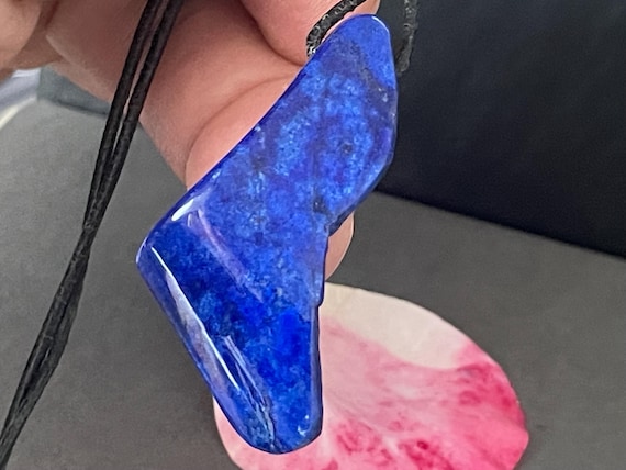Genuine lapis lazuli pendant drilled in a unique design