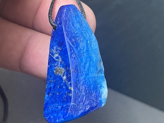 Special, genuine lapis lazuli pendant drilled in a unique design, unusually multicolored, natural colored