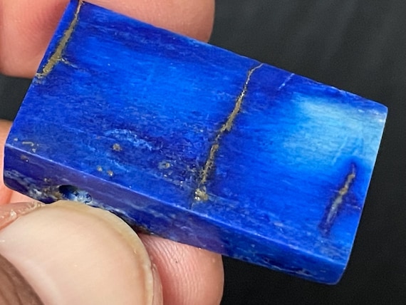 Genuine lapis lazuli pendant drilled in a unique design