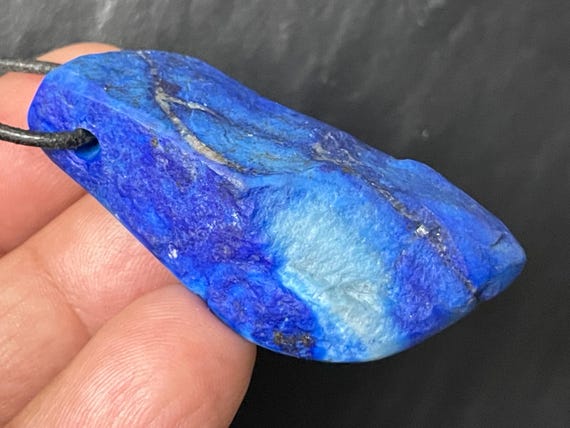 Genuine lapis lazuli pendant drilled in a unique design