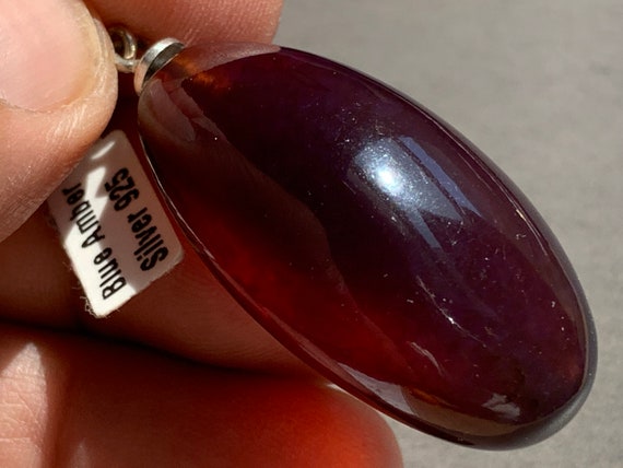 Phenomenal, rare blue amber pendant with sterling silver (925)