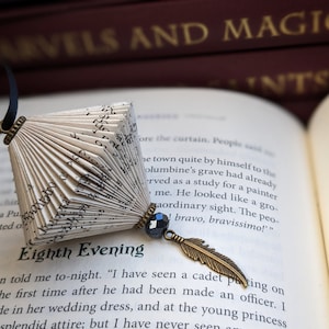 Folded book paper hanging ornament with feather charm image 1