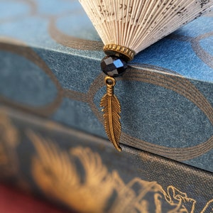 Folded book paper hanging ornament with feather charm image 4