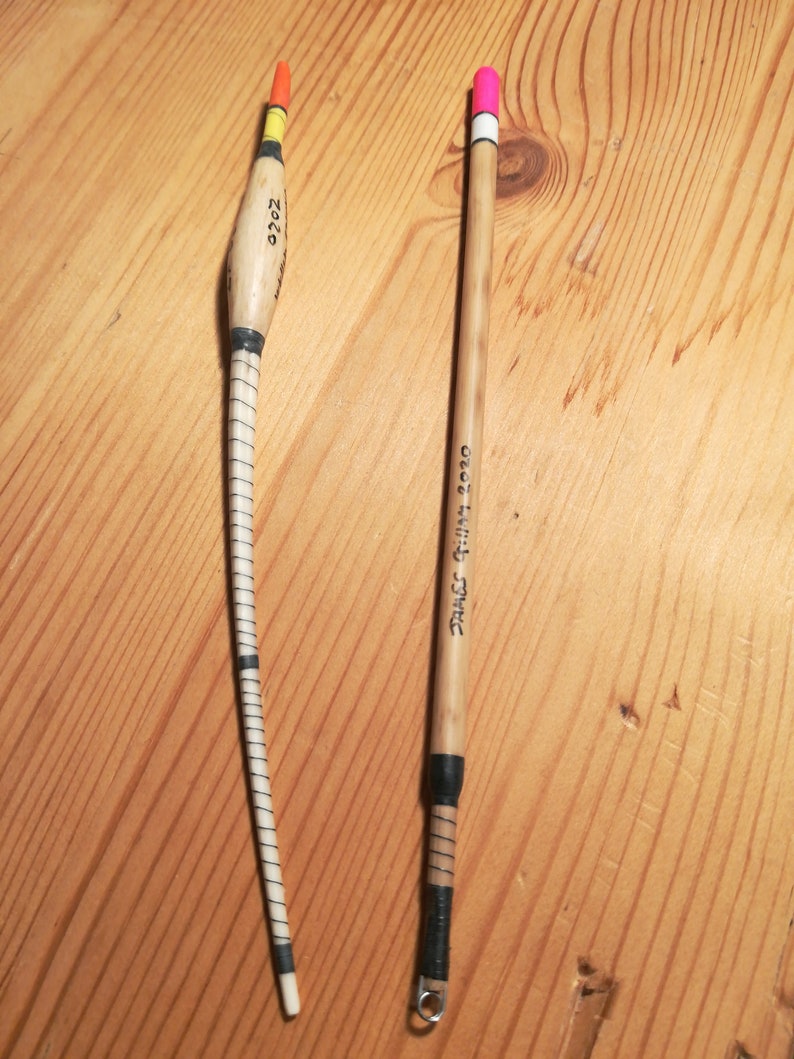 A Pair of Hand Crafted Fishing Floats Made With Natural Base Materials