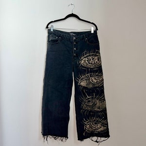 Malocchio Collection - Schwarze Jeans mit gebleichten Augen Motiven Größe 14