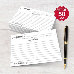 May include: A stack of white recipe cards with lined spaces for ingredients and instructions. The cards have the word "recipe" in cursive script and the text "from the kitchen of." A black pen with gold accents rests beside the cards. A red sticker reads "SET OF 50 cards."