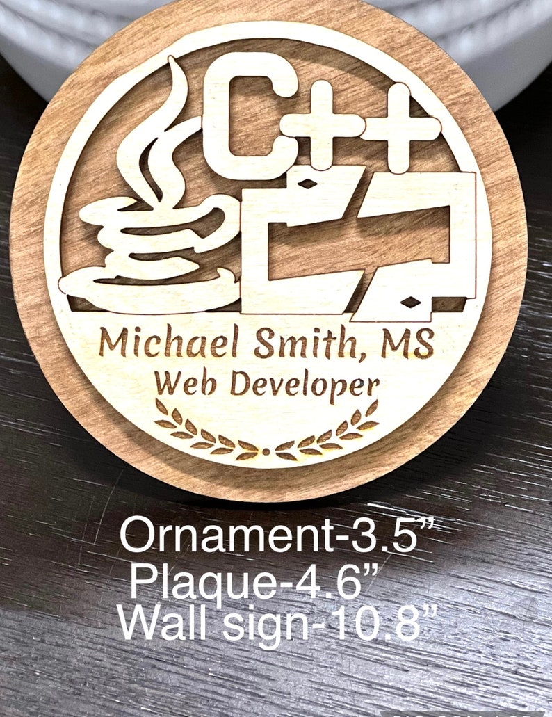 May include: A wooden plaque with a C++ logo, a coffee cup, and the text "Michael Smith, MS Web Developer". The plaque is available in three sizes: 3.5 inches, 4.6 inches, and 10.8 inches.