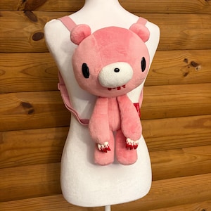gloomy bear mini backpack Chaos The adjustable gray straps ensure a comfortable fit Mini Backpacks Gloomy Bear Plush