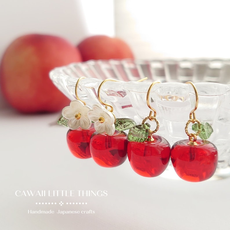 Resin apple earrings. Your choice of with or without flower.
Gold plated hypoallergenic hooks. (  Nickel free)