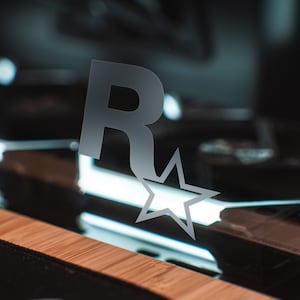 Stickers effet verre gravé pour vitre de PC - Logo Marque