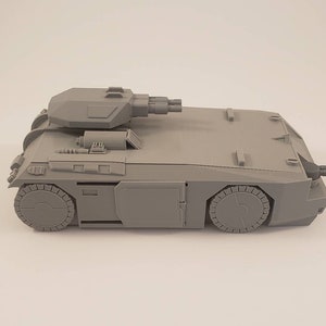 APC model with movable top turret and sliding door.