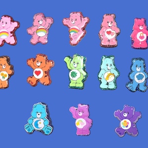 Bobines d'insigne Care Bear. Disponible en plusieurs couleurs et signes.