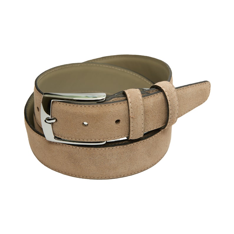 May include: A light brown suede belt with a silver buckle.
