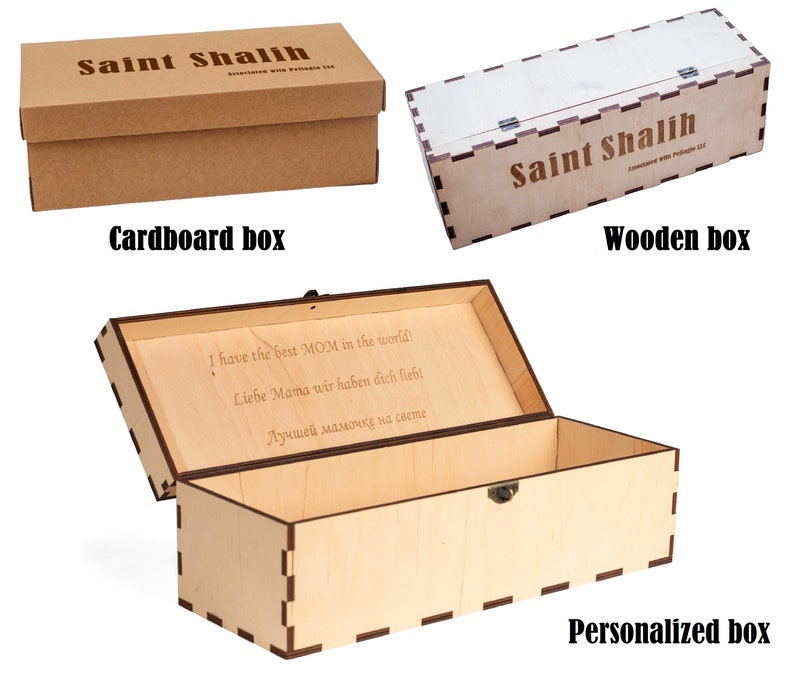 May include: Three wooden boxes with different designs. The first box is made of cardboard and has the text "Saint Shalih" printed on it. The second box is made of wood and has the text "Saint Shalih" printed on it. The third box is made of wood and has a personalized message engraved on the lid. The box is open and the inside is visible.