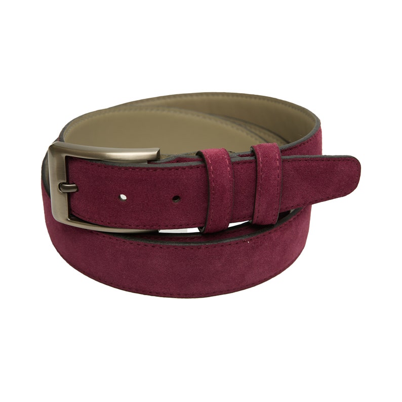 May include: A burgundy suede belt with a silver buckle.