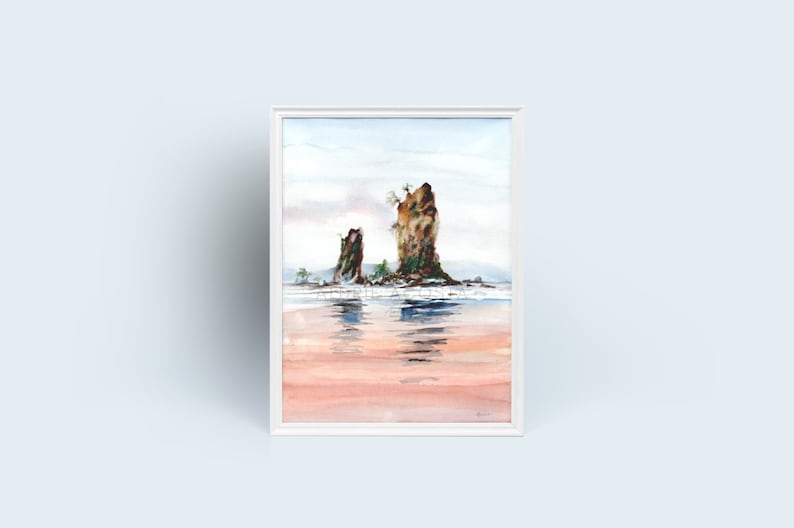 May include: Watercolor painting of two rock formations in the ocean, framed in white. The artwork depicts a serene coastal scene with soft colors, reflecting in the water. The sky is a pale blue, and the water has a pinkish hue.