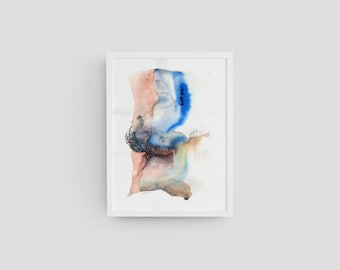 May include: Abstract watercolor painting in a white frame. The artwork features a blend of colors, including shades of blue, brown, and peach. The painting has a textured appearance with visible brushstrokes and a signature in the bottom left corner.